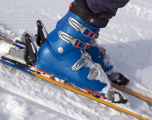 Traditional alpine ski bindings lock the boot onto the ski.