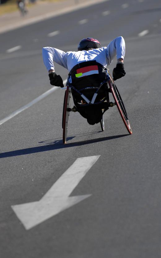 Athlete racing in a sport wheelchair.