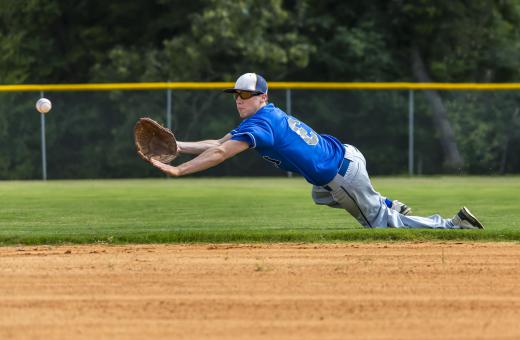 Cleats enable infielders to maintain some traction against the dirt that forms the baseline while fielding a hit.