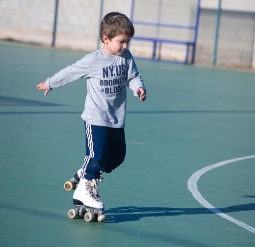 Roller skates have round stoppers positioned at the front for breaking.
