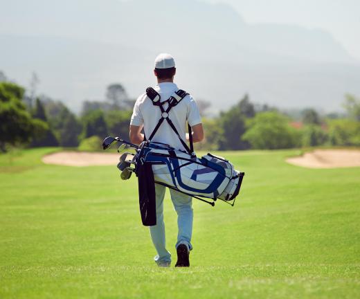 Caddies are responsible for transporting a golfer's bag and clubs around the course.