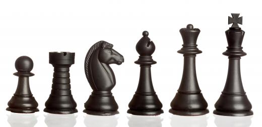 Pieces for chess, a board game.