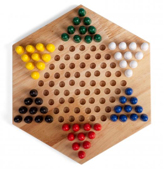 Wooden marbles can play a role in games like Chinese Checkers.