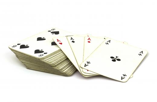 Playing 52 card pick-up could involve purposely dropping a deck of cards and having a person pick all 52 cards off the ground.