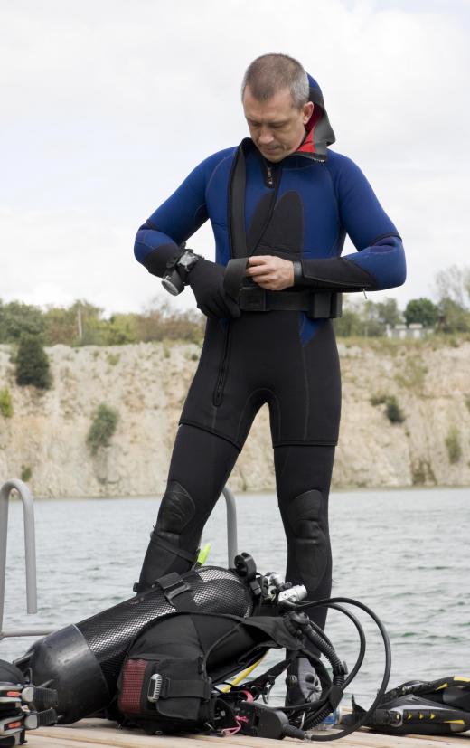A prismatic compass, which can be worn over a wetsuit, assists divers with underwater navigation.