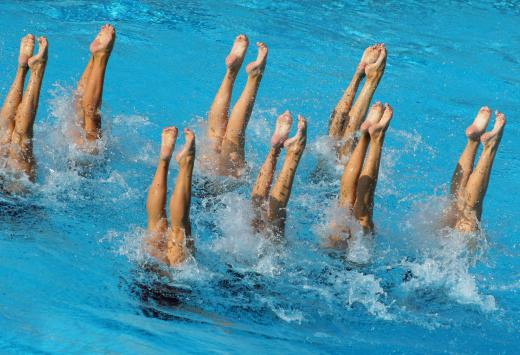 Synchronized swimmers make difficult moves look easy.