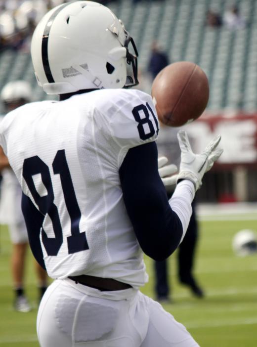 Football receivers catch passes, usually thrown by a quarterback.