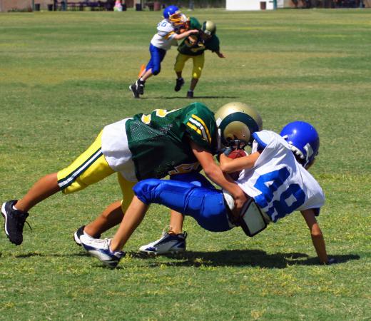Defensive tackles are responsible for tackling the offensive player who is carrying the football.