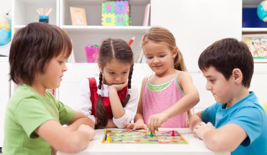 A group of children playing a board game.