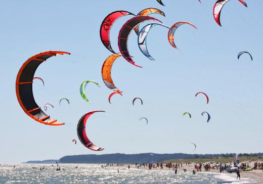 In kite surfing, large kites are used to pull boards similar surfboards.
