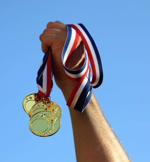 An Olympic gold medal is symbolic of grand achievement.