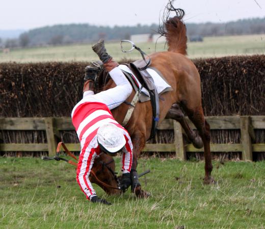 A horse racing jockey is at constant risk of falling from the horse and sustaining trauma to the brain.