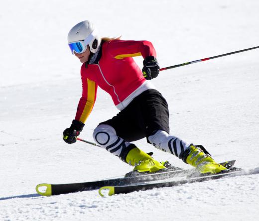 A person skiing before going to a warming hut.
