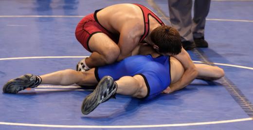 Wrestling shoes are designed specifically to be worn during wrestling to provide traction and ankle support.