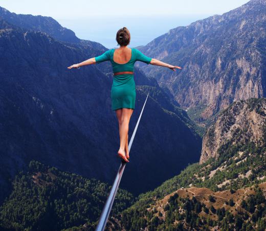 A tightrope walker is a person trained in acrobatics.